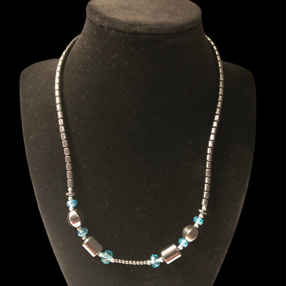 Hematite necklace with light blue beads.